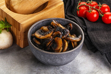 Roasted champignon mushrooms in the bowl