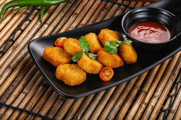 Crispy golden choclen nuggets with sauce