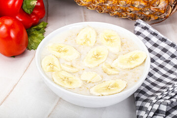 Sweet porridge with banana breakfast