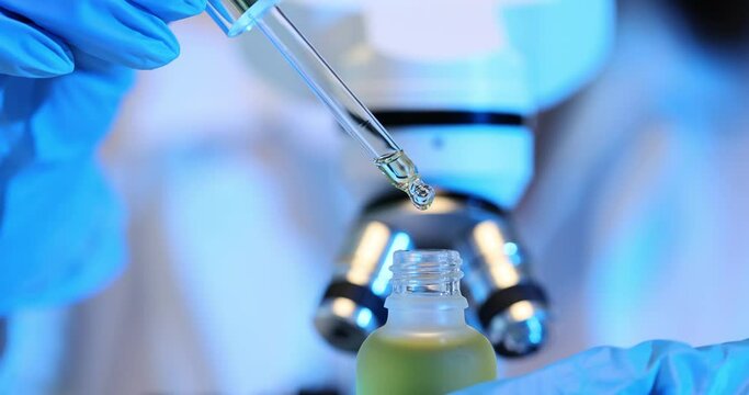 Scientist in lab is researching cosmetic oil for skin rejuvenation