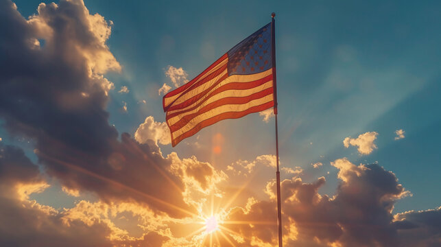 american falg waving in the sky in sunset