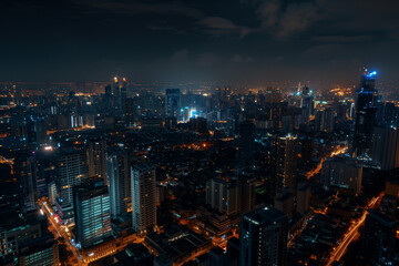 Obraz premium City Skyline at Night: Aerial View of Illuminated Skyscrapers