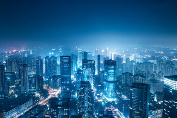 Fototapeta premium City Skyline at Night: Aerial View of Illuminated Skyscrapers