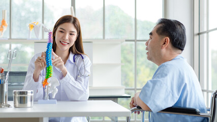 Asian woman, orthopedic doctor consulting elderly patient with spine to his patient injury...