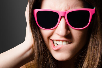 Black background, funny face and girl with sunglasses, studio and style of Gen z, fashion and...