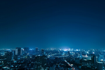 Obraz premium Aerial Night View of Skyscrapers from Drone's Perspective