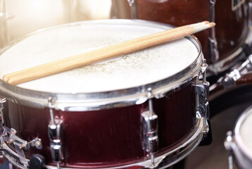 Closeup, drum and drumsticks in music studio for performance, recording and live show on stage....