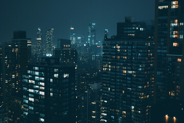 Obraz premium City Skyline at Night: Aerial View of Illuminated Skyscrapers