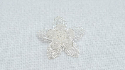 Silver jewelry display on white background