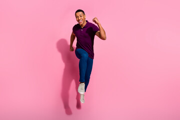 Full length photo of nice young male running hurry black friday dressed stylish violet garment isolated on pink color background