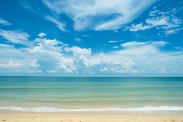 Obraz premium Sunlit Beach with Blue Sky and Ocean View