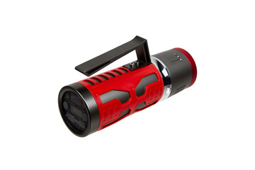 Modern metal LED flashlight in red color. Portable flashlight isolate on a white back