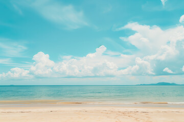 Fototapeta premium Sunlit Beach with Blue Sky and Ocean View