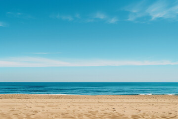 Fototapeta premium Sunlit Beach with Blue Sky and Ocean View