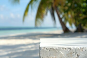 Minimalistic close-up of white stone surface with blurred tropical beach background