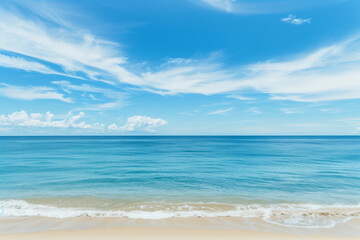 Fototapeta premium Sunlit Beach with Blue Sky and Ocean View