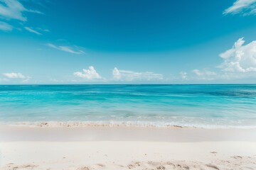 Obraz premium Sunlit Beach with Blue Sky and Ocean View