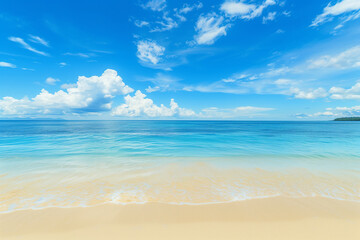 Fototapeta premium Sunlit Beach with Blue Sky and Ocean View
