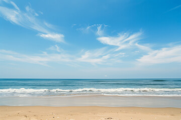 Fototapeta premium Sunlit Beach with Blue Sky and Ocean View