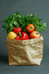 Colorful fresh produce items in paper bag on solid background