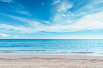 Obraz premium Sunlit Beach with Blue Sky and Ocean View
