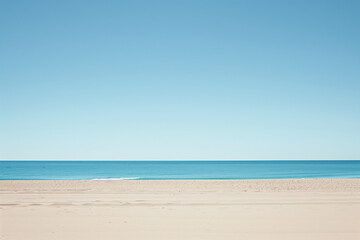 Fototapeta premium Sunny Beach with Blue Sky and Ocean View