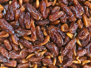 dates close up. date palm background. Date palm on a traditional craftsman market.Horizontal image.
