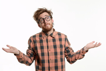 Confused Young Man with Glasses and Plaid Shirt Shrugging Shoulders