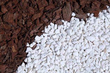 Top view small pebbles and tree bark chips on the ground