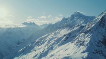Pristine snowy peaks reach for the skies, embodying the serene majesty of a mountain range.