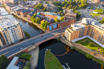 Aerial footage of the Leeds city centre in West Yorkshire in the UK showing the main bridge going...