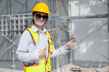 Portrait Female Construction Worker Inspecting Materials On Construction Site Approved