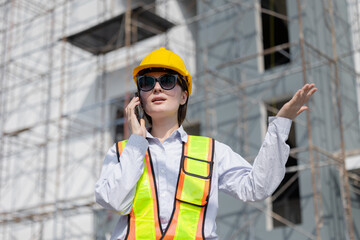 Engineer Woman Construction Worker Speaking on Phone at Worksite