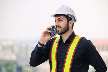 Construction Worker Speaking on Phone at Worksite