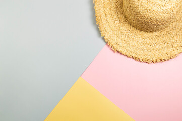 Top view of straw hat on colourful background. Summer fashion, vacation and beach wallpaper. Copy...
