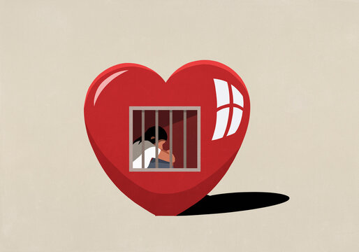 Sad woman sitting behind bars in prison of heart

