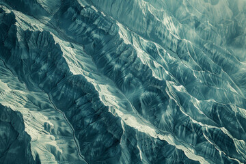Minimalist aerial view of mountain ridges, showcasing sharp lines and natural patterns in the terrain. 