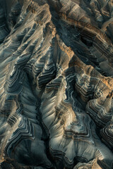 Minimalist aerial view of mountain ridges, showcasing sharp lines and natural patterns in the terrain. 