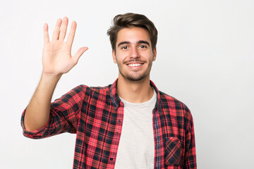 Handsome Young Man in Checkered Shirt Waving Hand and Smiling at Camera Against White Background