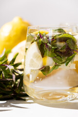 A glass of refreshing lemon water with mint