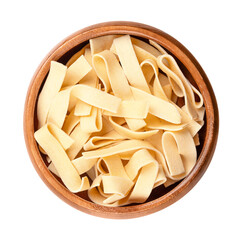 Sagnette, smooth ribbon pasta, in a wooden bowl. Uncooked, short thick ribbons of noodles, also called laminated pasta, made of durum wheat semolina and egg. Close-up from above, isolated food photo.