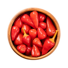 Pickled red hot baby peppers, in a wooden bowl. Small hot chilis, pepperonis, or Capsicum pepper,...