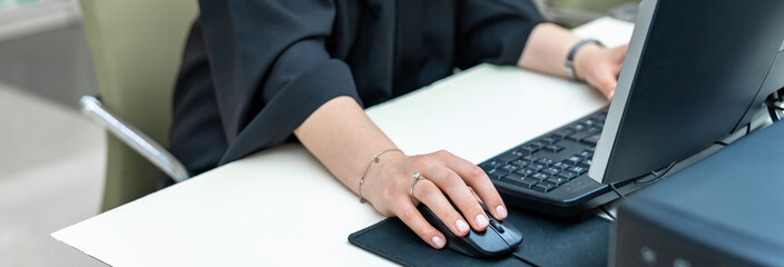 Woman working on computer in office, banking concept, stock photo