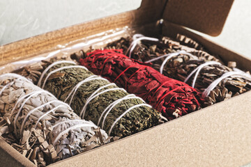 Set of different herbal bundles for purification smudging rituals.