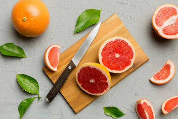 fresh Fruit grapefruit slices on colored background. Top view. Copy Space. creative summer concept....