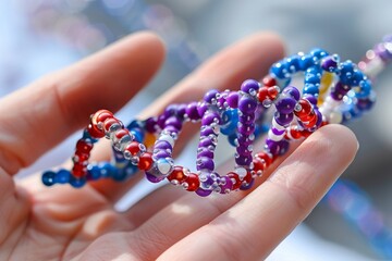 Multicolored DNA Model in Hands, Representing the Spectrum of Human Genetic Diversity