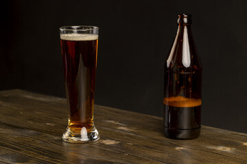 dark beer in a glass glass, fresh dark alcoholic beer