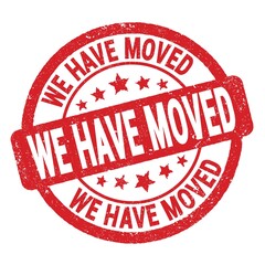 WE HAVE MOVED text written on red round stamp sign.