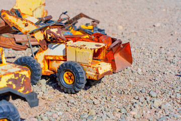 Toy Excavator On a Gravel Surface