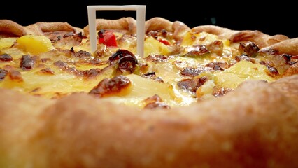 A mesmerizing macro view of pizza perfection - gooey cheese and savory sausage in delicious detail. Culinary and meal concept. Pizza background. 
